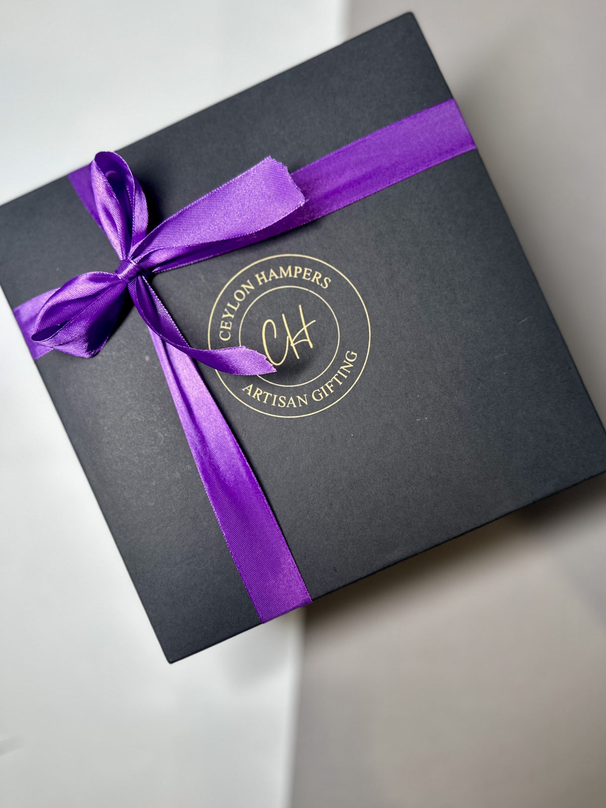 Black box with purple bow
