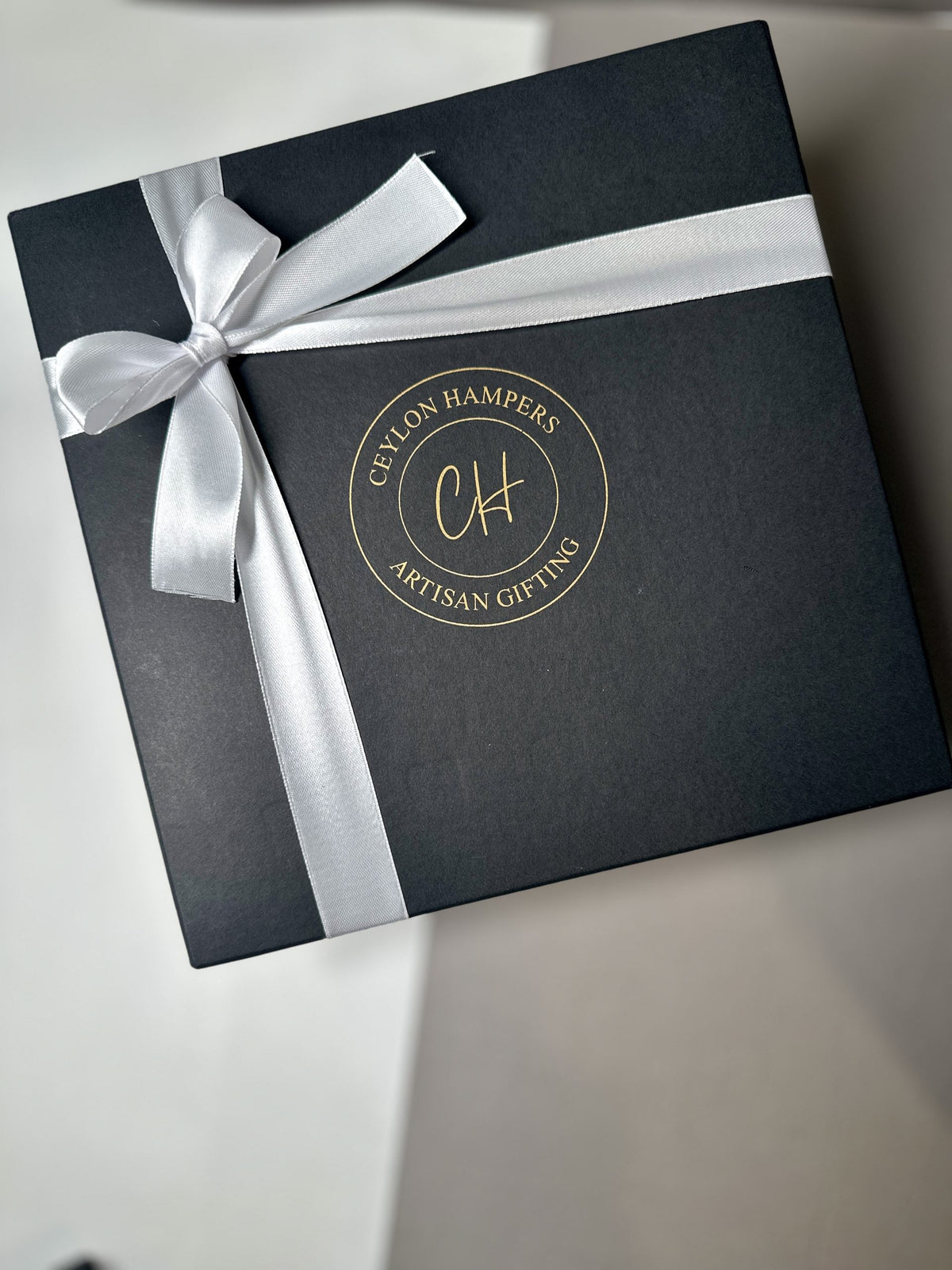 Black box with white bow