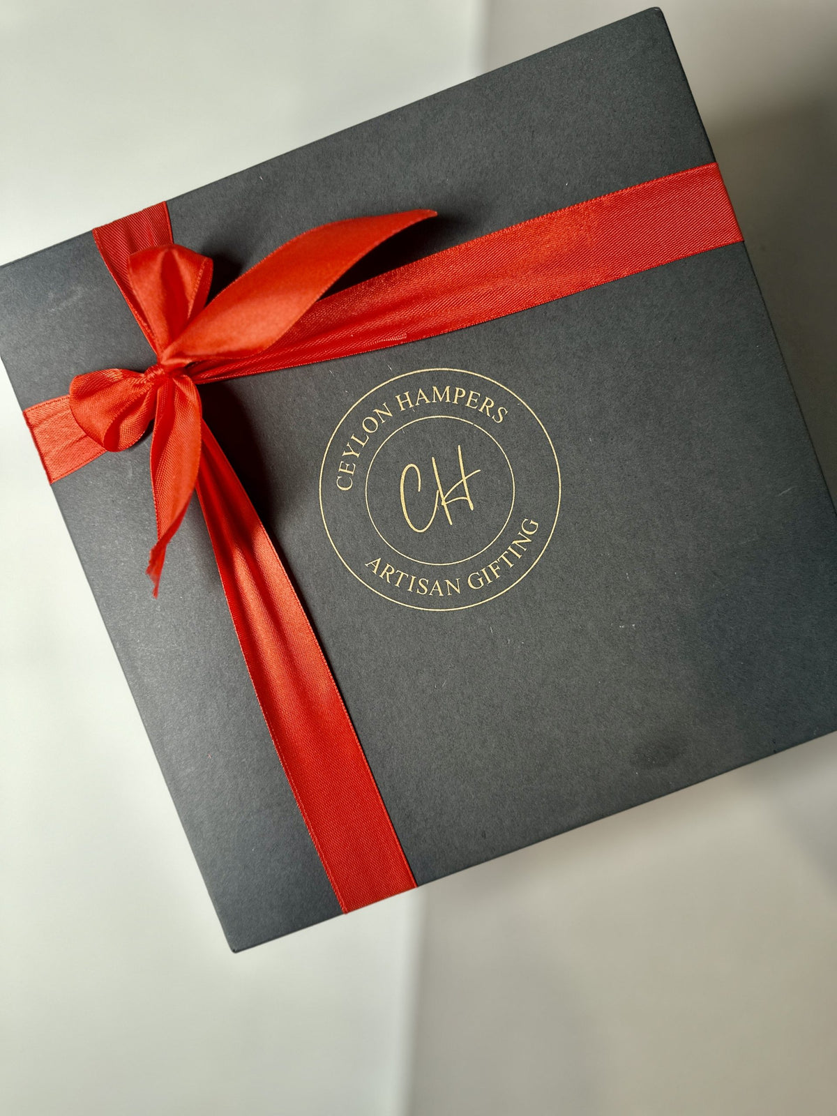 Black box with red ribbon